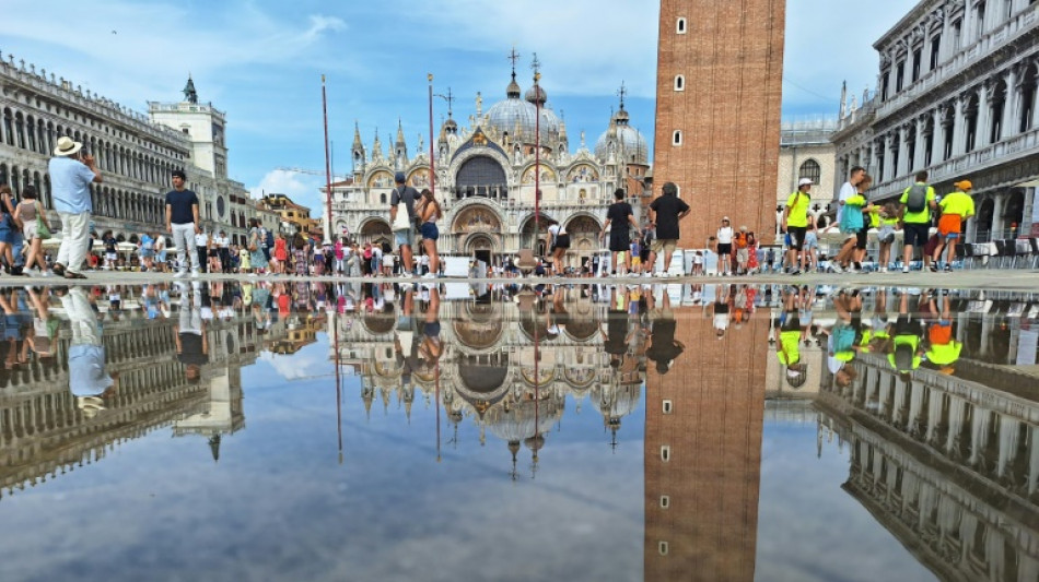 Venetians plead 'please don't come' as tourists jam city