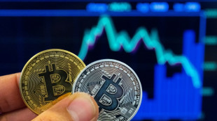 Stocks diverge; bitcoin hits fresh record high