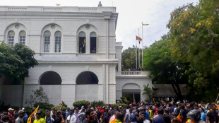 Sri Lanka leader flees as protesters storm home, office