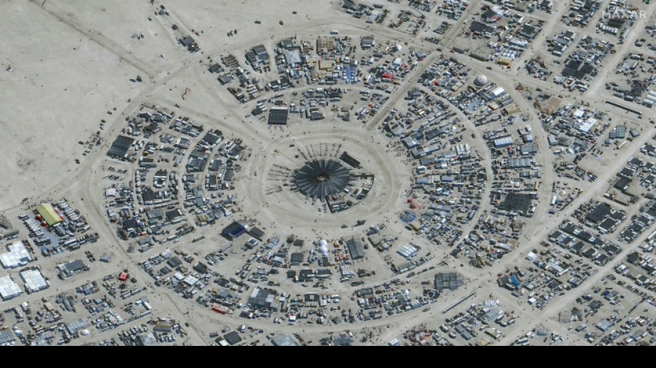 Desert downpours dampen spirits of Burning Man festival in Nevada