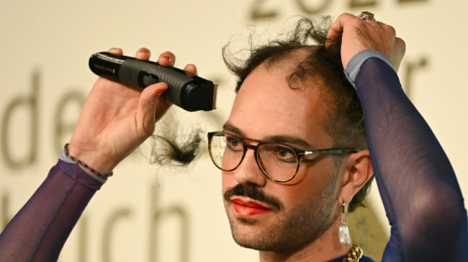 Swiss author shaves head on stage after winning award