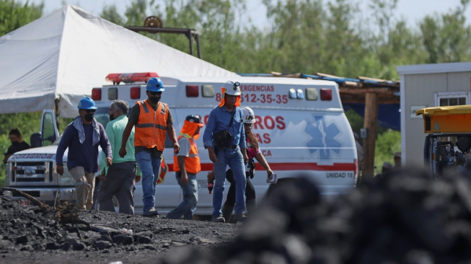 Families of trapped Mexican miners pray for miracle