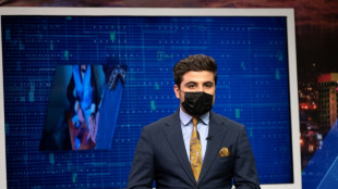 Afghan male TV presenters wear masks in protest against Taliban