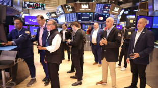 Wall Street termine en hausse, nouveau record pour le Dow Jones