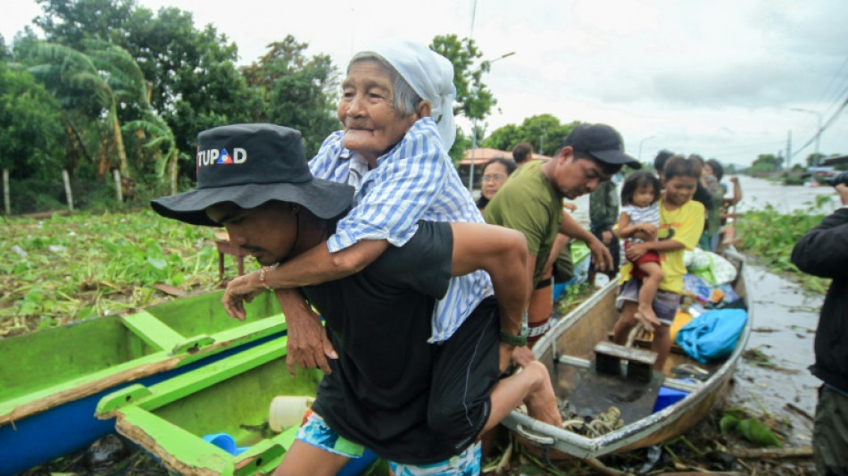 Philippines races to reach stranded as storm's death toll rises