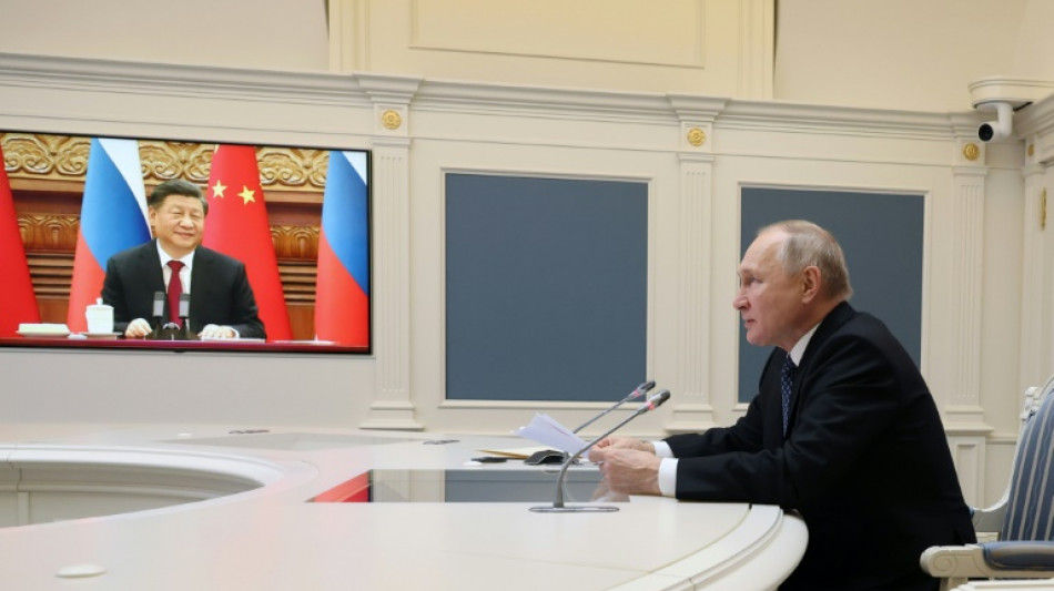 Putin tells Xi he wants to ramp up military cooperation 