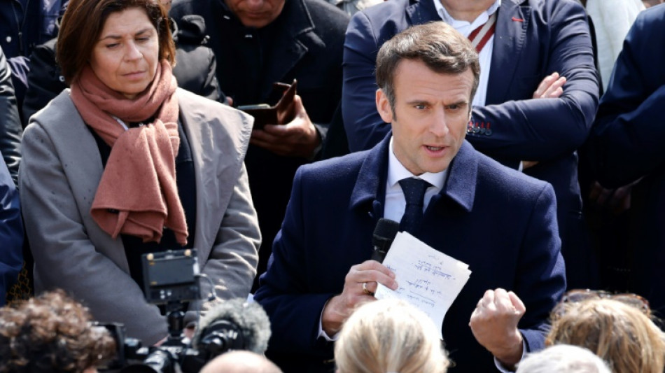 Macron holds first rally as France election race tightens