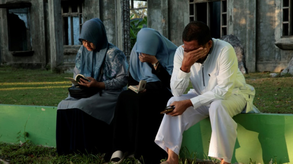 Tears, prayers as Asia mourns tsunami dead 20 years on