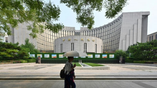 China central bank says cuts two key rates to support economy