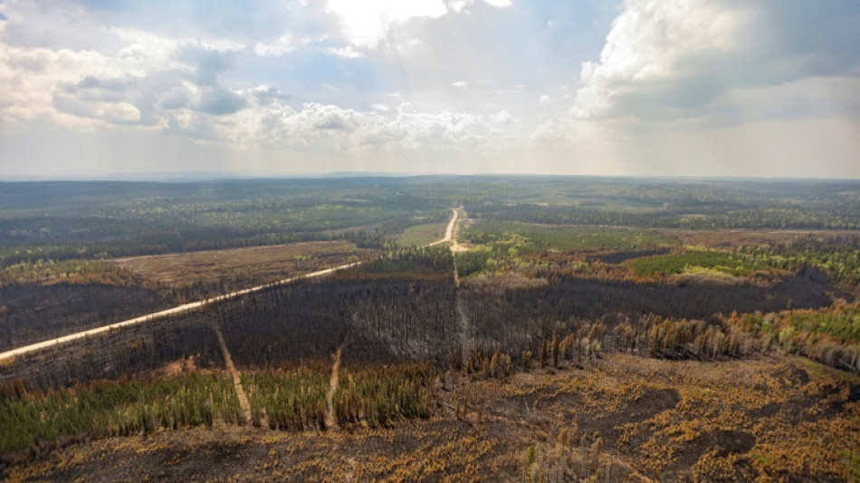 Wildfires abate slowly in western Canada