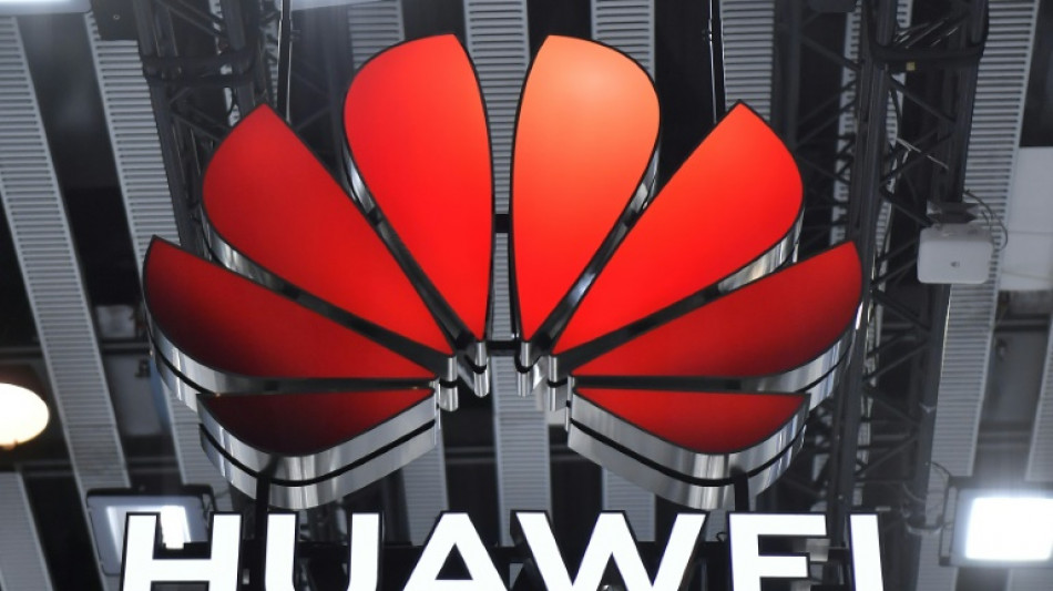 Huawei reports huge drop in profits as US sanctions bite