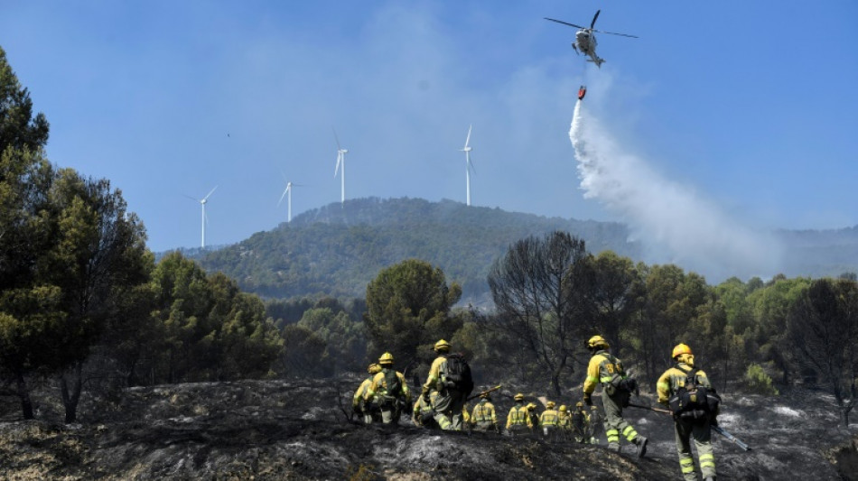 Spain, Portugal battle to control huge wildfires