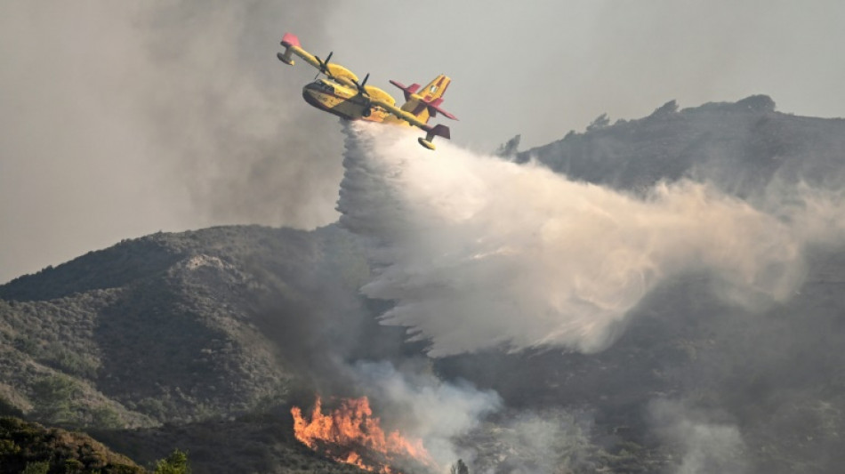 Firefighting plane crashes in Greece as wildfires rage