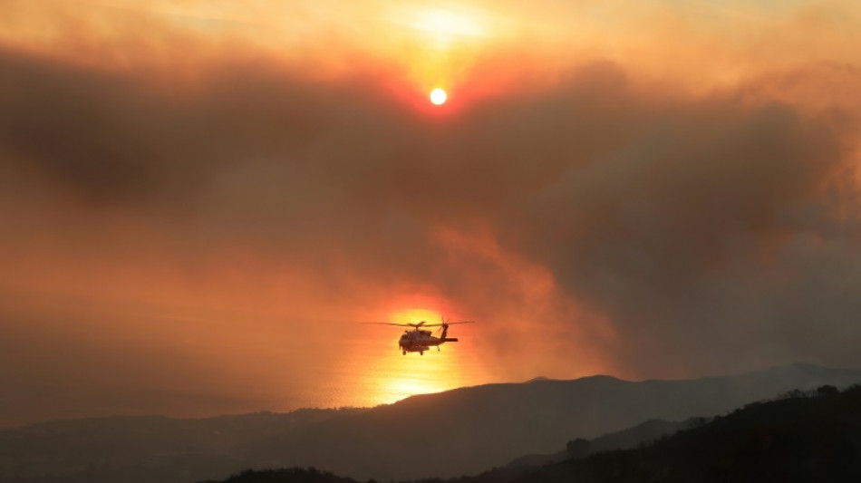 Wildfire in Malibu destroys homes, sends thousands fleeing