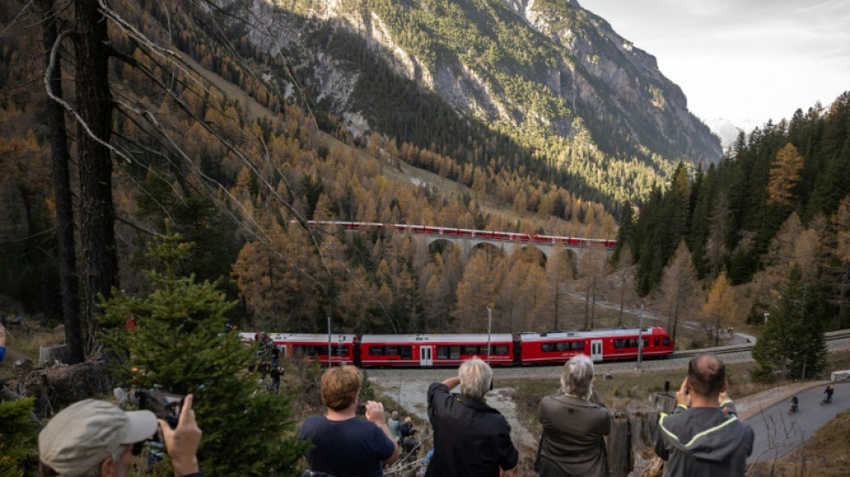 Like clockwork: World's longest passenger train winds through Swiss Alps