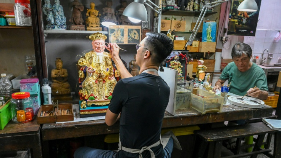 Singaporean artisan family keeps religious effigy art alive