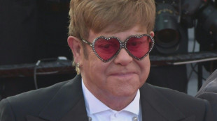 Elton John hails fans at emotional final farewell show