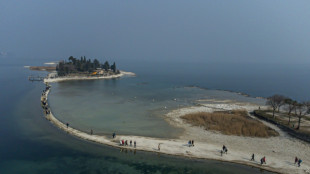 Lake Garda tourists flock to island reconnected by drought