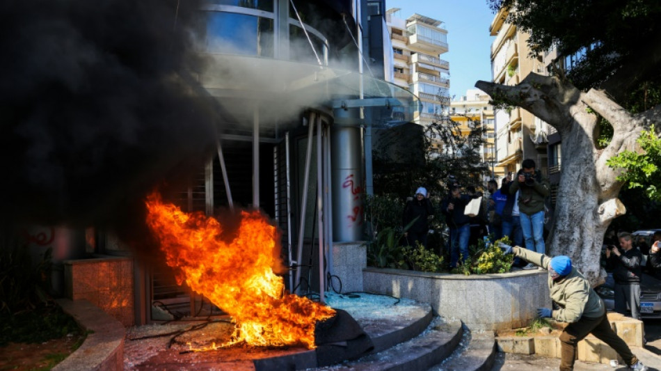 Lebanese protesters smash bank facades as crisis bites