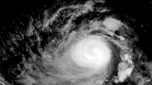 Guam 'weathers storm' as Typhoon Mawar moves west