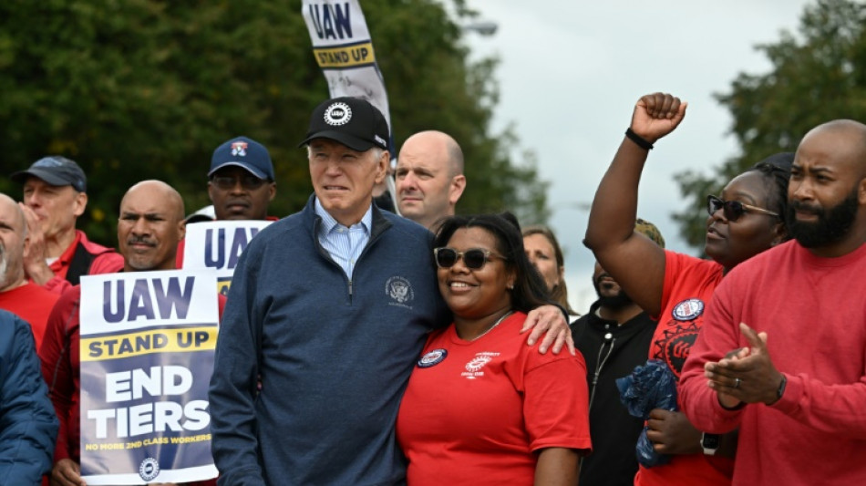 Biden makes history by joining striking US car workers