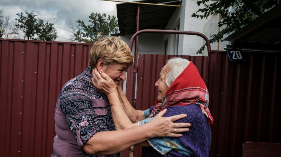 Tears of relief as Ukraine frontline families reunite