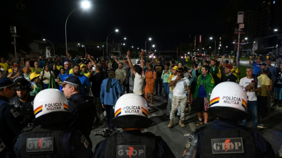 Bolsonaro supporters clash with police, set fires in Brasilia